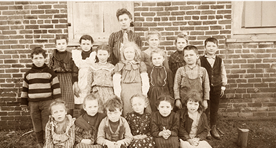 Northfield’s Brown School teacher taught every grade, and boarded with Julia Donovan in her log cabin across the street on Willow Road