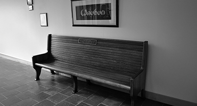Village Keepsakes—The Wau Bun sign and bench that graced Northfield’s train station in 1926 are today, a century later, on display at Village Hall.