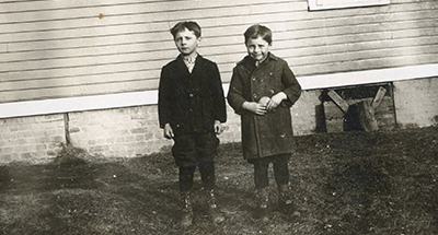 Despite the Depression, the splendid new Sunset Ridge School opened its doors to Northfield farm families like the Schmidts, who farmed on the west side of Sunset Ridge Road, just south of Voltz Road, where Valley Way and East Circle are today. Pictured are sons Charlie and Artie.