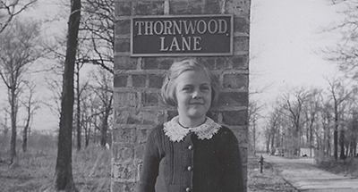 Judy Blake Ives was a new breed of Northfielder. Her dad, C.B. Blake, was a dentist, and they came to Northfield from Wilmette in 1933. Dr. Blake came up with the name Thornwood Lane, where they built their dream home at 590 Thornwood Lane.