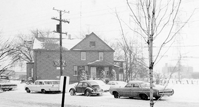 Carper’s Tavern (pictured here in 1965, with the sign, “Liquor Store”) where Northfield’s Public Library is today, was a Northfield hotspot. It began as Selzer’s general store around 1915; then Al Levernier bought it in the 1920’s; and he turned it into a tavern right after Prohibition was repealed in 1933.