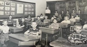 Steve Harper (center) as a second-grader at Sunset Ridge School. On his far right is classmate Holly Wheeler Brady.