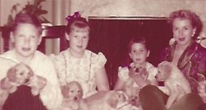 My family, on Pebblefork Lane—(from left) my brother Stormy, then me, and my younger sister Meredi with our mom and pups.